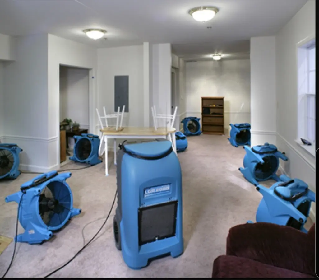 Air movers and dehumidifier setup for Water Damage Restoration in Armada